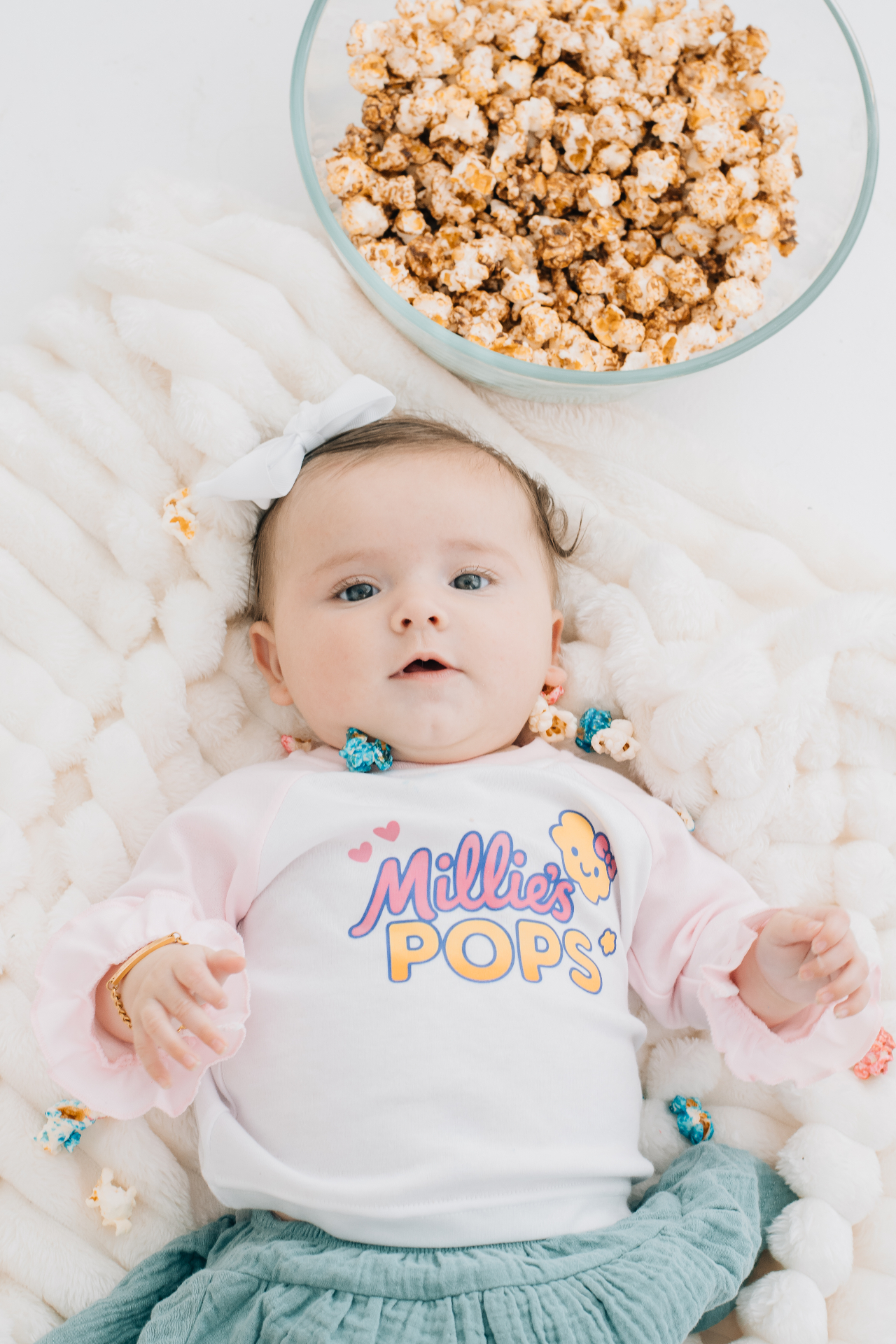 Baby Millie with Millie's Pops popcorn